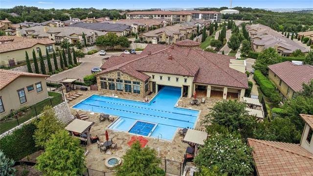 104 Bella Toscana Ave Unit 2301, Lakeway, TX 78734 - community pool featuring a patio and a residential view