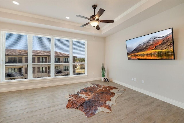 104 Bella Toscana Ave Unit 2301, Lakeway, TX 78734 - unfurnished room featuring wood finished floors, recessed lighting, baseboards, a raised ceiling, and ornamental molding