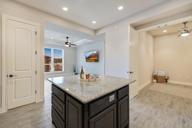 104 Bella Toscana Ave Unit 2301, Lakeway, TX 78734 - kitchen featuring ceiling fan, light wood finished floors, a center island, recessed lighting, and baseboards