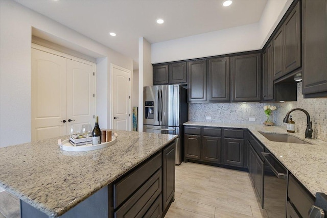 104 Bella Toscana Ave Unit 2301, Lakeway, TX 78734 - kitchen featuring dishwashing machine, stainless steel fridge, light stone countertops, a center island, and tasteful backsplash