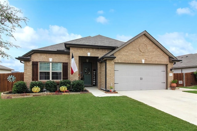 180 Sunshine Ln, Kyle, TX 78640 - view of front facade with fence, an attached garage, driveway, and brick siding