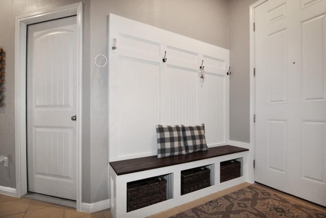 180 Sunshine Ln, Kyle, TX 78640 - mudroom featuring baseboards and light tile patterned flooring