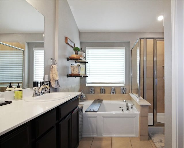 180 Sunshine Ln, Kyle, TX 78640 - bathroom with tile patterned floors, a stall shower, vanity, and a garden tub