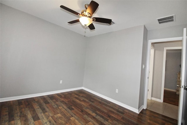 180 Sunshine Ln, Kyle, TX 78640 - spare room featuring ceiling fan and dark wood-style floors