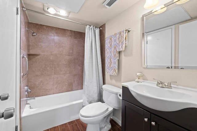 9226 Jollyville Rd Unit 170, Austin, TX 78759 - full bath featuring vanity, shower / tub combo, toilet, and wood finish floors