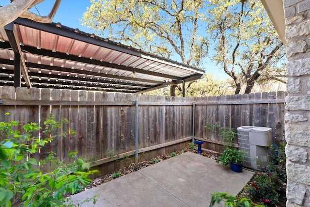 9226 Jollyville Rd Unit 170, Austin, TX 78759 - fenced backyard featuring central AC and a patio