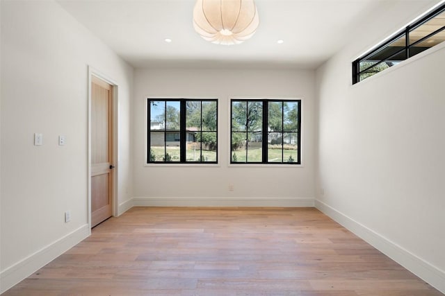 2209 Bowman Ave, Austin, TX 78703 - empty room with light wood-style flooring, baseboards, and recessed lighting