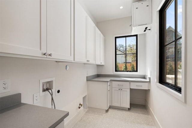 2209 Bowman Ave, Austin, TX 78703 - laundry room with cabinet space, baseboards, hookup for an electric dryer, and hookup for a washing machine