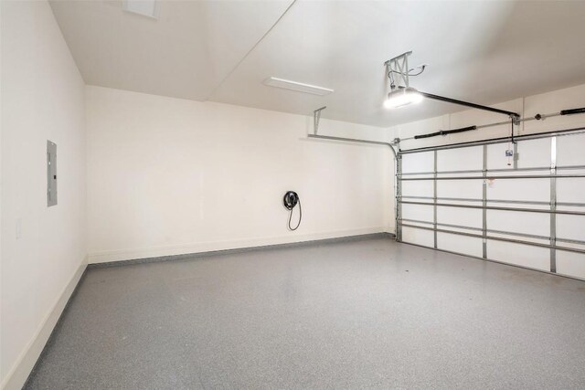 2209 Bowman Ave, Austin, TX 78703 - garage with baseboards and a garage door opener