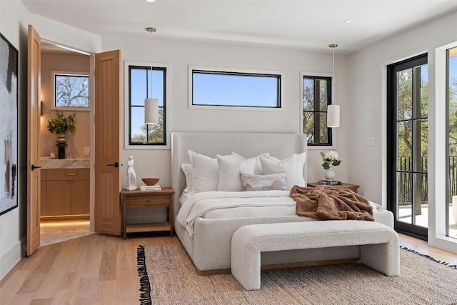 2209 Bowman Ave, Austin, TX 78703 - bedroom featuring access to outside, light wood-style floors, and recessed lighting