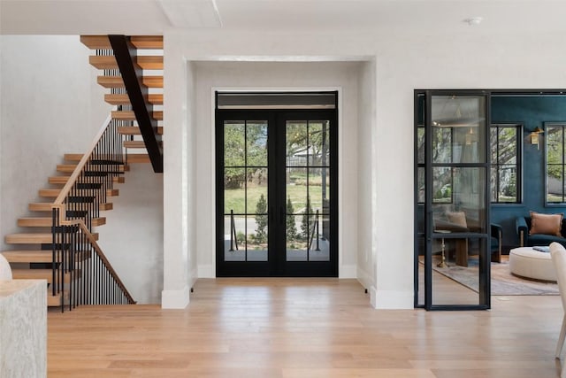 2209 Bowman Ave, Austin, TX 78703 - entrance foyer with wood finished floors, stairway, and baseboards