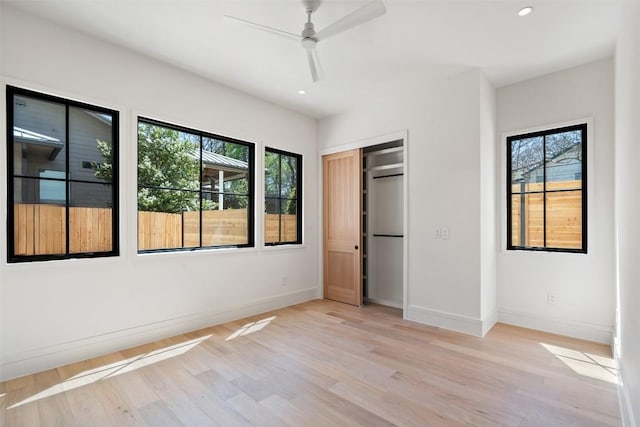 2209 Bowman Ave, Austin, TX 78703 - unfurnished bedroom featuring light wood finished floors, baseboards, recessed lighting, a closet, and a ceiling fan
