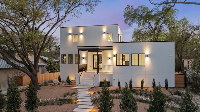 2209 Bowman Ave, Austin, TX 78703 - contemporary house featuring stucco siding, stairway, and covered porch