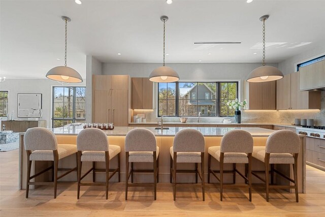2209 Bowman Ave, Austin, TX 78703 - kitchen featuring modern cabinets, recessed lighting, a spacious island, and plenty of natural light