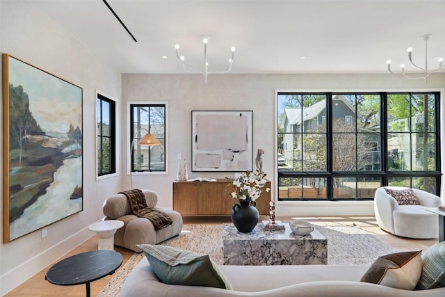 2209 Bowman Ave, Austin, TX 78703 - living area with a chandelier, healthy amount of natural light, wood finished floors, baseboards, and recessed lighting