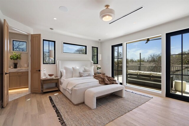 2209 Bowman Ave, Austin, TX 78703 - bedroom featuring access to exterior, light wood finished floors, and recessed lighting