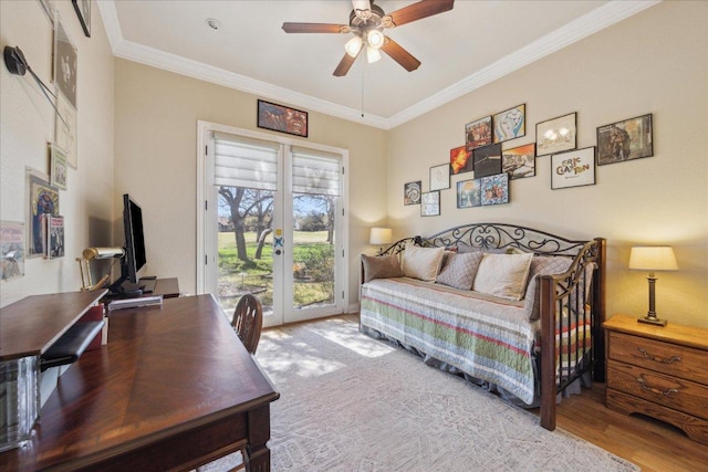 bedroom with crown molding, french doors, wood finished floors, and access to exterior