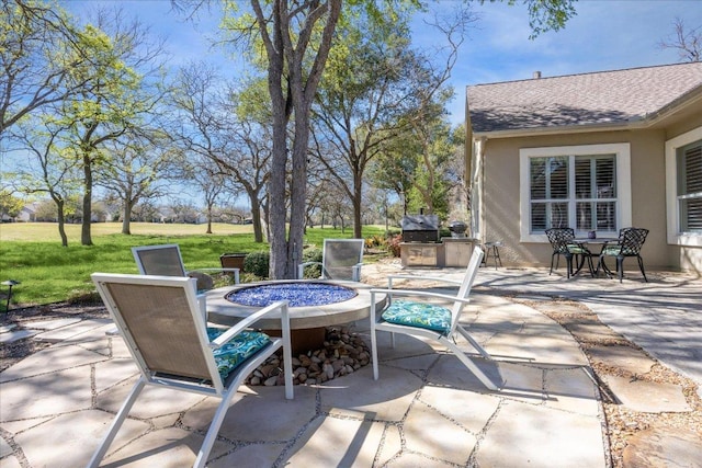 view of patio / terrace featuring a fire pit and area for grilling