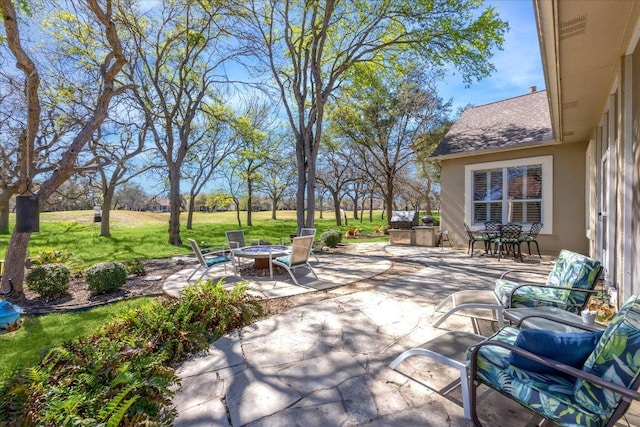 view of patio featuring an outdoor fire pit