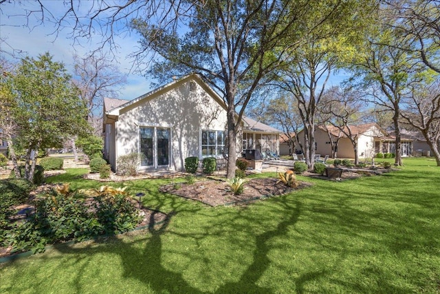 rear view of house with a yard