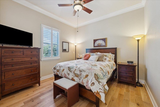 bedroom featuring light wood-style floors, baseboards, and ornamental molding