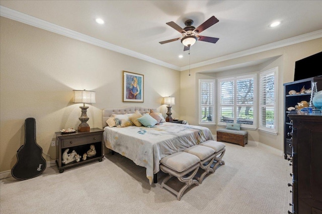 carpeted bedroom with recessed lighting, baseboards, crown molding, and ceiling fan