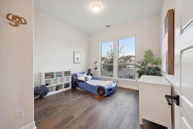 19302 Summit Glory Trl Unit 68, Spicewood, TX 78669 - bedroom with dark wood-style flooring and baseboards
