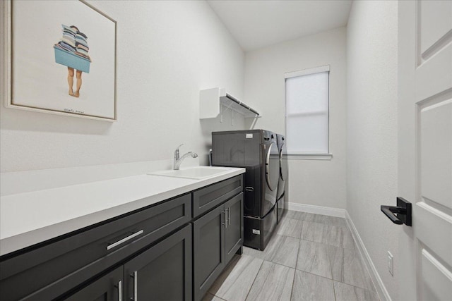 19302 Summit Glory Trl Unit 68, Spicewood, TX 78669 - laundry area with washer and dryer, cabinet space, and baseboards