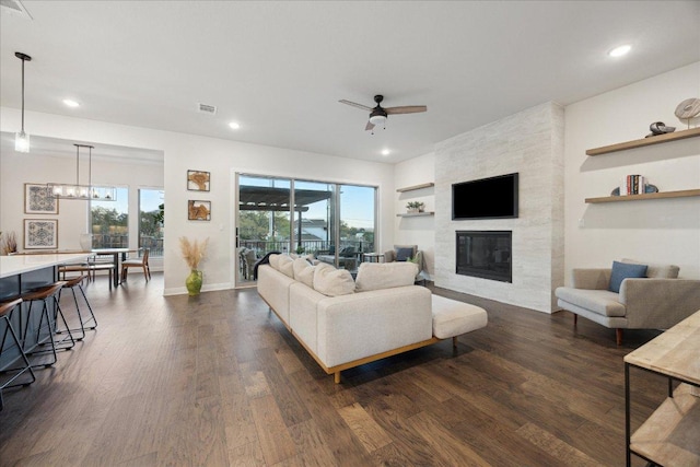 19302 Summit Glory Trl Unit 68, Spicewood, TX 78669 - living area with ceiling fan, healthy amount of natural light, dark wood-style flooring, recessed lighting, and a fireplace