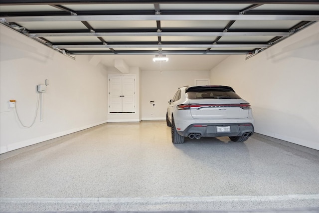 19302 Summit Glory Trl Unit 68, Spicewood, TX 78669 - garage featuring baseboards