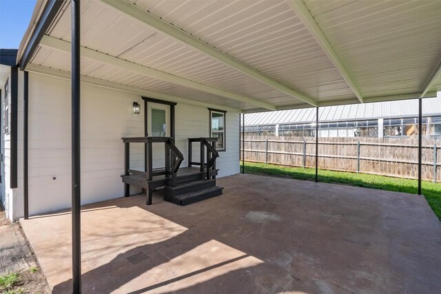 view of patio / terrace featuring fence
