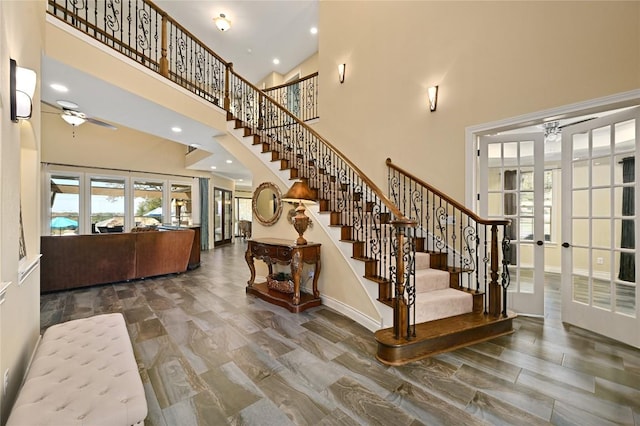2624 University Club Dr, Austin, TX 78732 - staircase with ceiling fan, a towering ceiling, plenty of natural light, and french doors