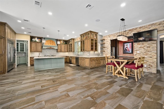2624 University Club Dr, Austin, TX 78732 - kitchen featuring visible vents, brown cabinets, appliances with stainless steel finishes, and custom range hood