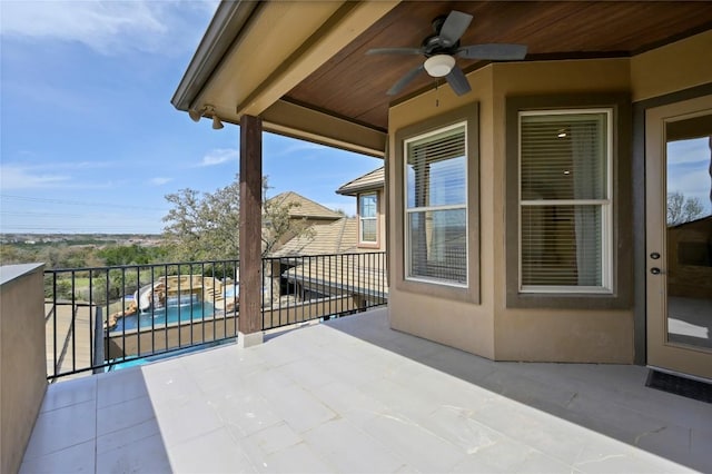 2624 University Club Dr, Austin, TX 78732 - view of patio / terrace with a balcony and a ceiling fan
