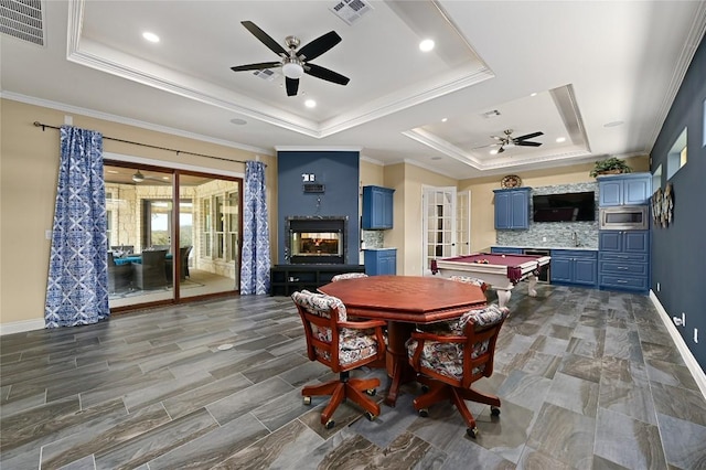 2624 University Club Dr, Austin, TX 78732 - dining room featuring visible vents, a raised ceiling, and ceiling fan