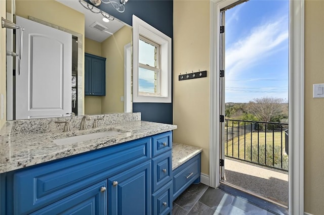 2624 University Club Dr, Austin, TX 78732 - bathroom with visible vents, a healthy amount of sunlight, and vanity