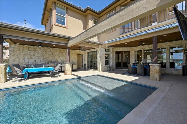 2624 University Club Dr, Austin, TX 78732 - rear view of house featuring a balcony, ceiling fan, french doors, a patio, and stone siding