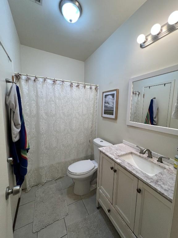 2905 Swisher St Unit 207, Austin, TX 78705 - full bathroom featuring vanity, tile patterned floors, and curtained shower