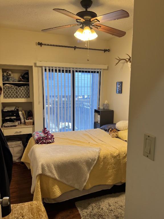 2905 Swisher St Unit 207, Austin, TX 78705 - bedroom featuring wood finished floors and a ceiling fan