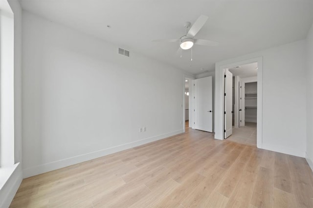1701 Simond Ave Unit 426, Austin, TX 78723 - empty room featuring ceiling fan, light wood-style floors, and baseboards