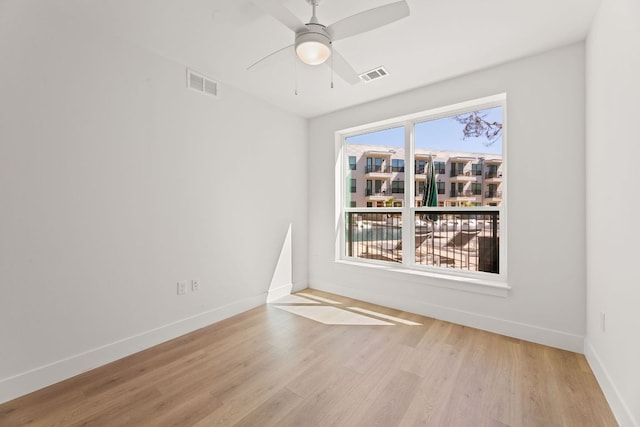 1701 Simond Ave Unit 426, Austin, TX 78723 - empty room with wood finished floors, baseboards, and a ceiling fan