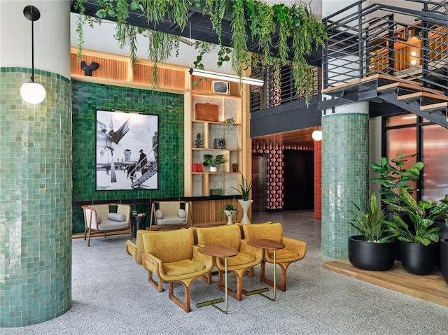 1701 Simond Ave Unit 426, Austin, TX 78723 - common area featuring a towering ceiling and stairway