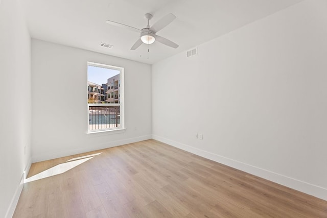 1701 Simond Ave Unit 426, Austin, TX 78723 - unfurnished room featuring baseboards, light wood-style floors, and a ceiling fan