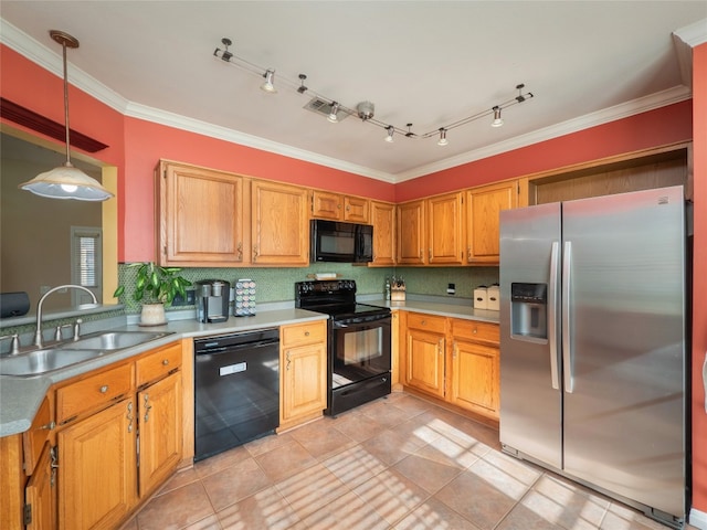 16501 Spotted Eagle Dr, Leander, TX 78641 - kitchen with black appliances, backsplash, ornamental molding, decorative light fixtures, and light countertops