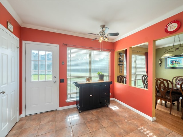 16501 Spotted Eagle Dr, Leander, TX 78641 - entrance foyer featuring healthy amount of natural light, ornamental molding, a ceiling fan, and light tile patterned floors