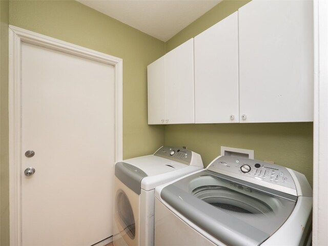 16501 Spotted Eagle Dr, Leander, TX 78641 - washroom featuring washer and clothes dryer and cabinet space