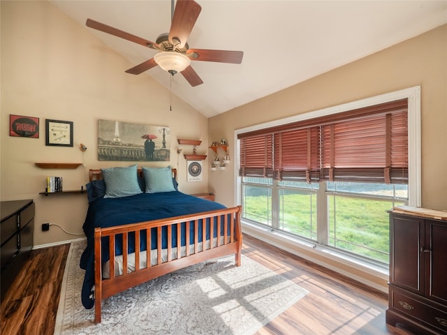 16501 Spotted Eagle Dr, Leander, TX 78641 - bedroom featuring lofted ceiling, multiple windows, wood finished floors, and ceiling fan