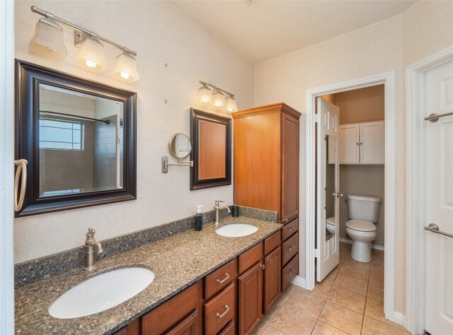 16501 Spotted Eagle Dr, Leander, TX 78641 - full bath with double vanity and tile patterned floors