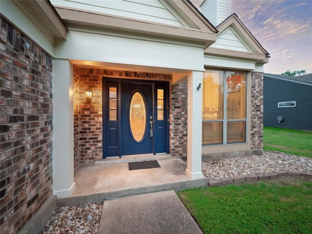 16501 Spotted Eagle Dr, Leander, TX 78641 - entrance to property with brick siding, a chimney, and covered porch
