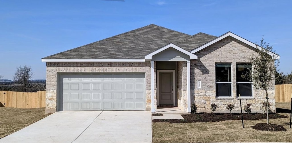 837 Bobby Lou Ln, Copperas Cove, TX 76522 - single story home with fence, roof with shingles, concrete driveway, a garage, and stone siding